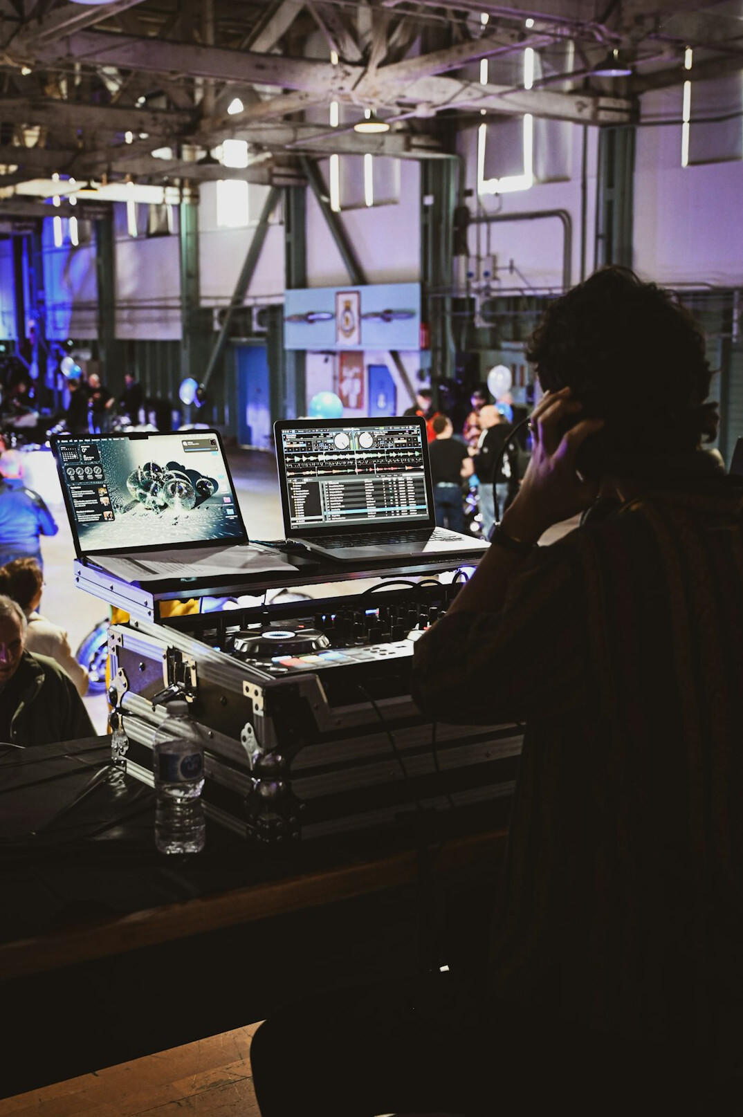 Television control room with rows of monitors and mixing consoles